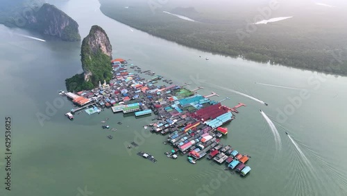 Aerial view of Koh Panyee is a fishing village in Phang Nga province, Thailand. There is a floating soccer field. This island is the main attraction of the Phang Nga Bay tour. Popular food stops photo