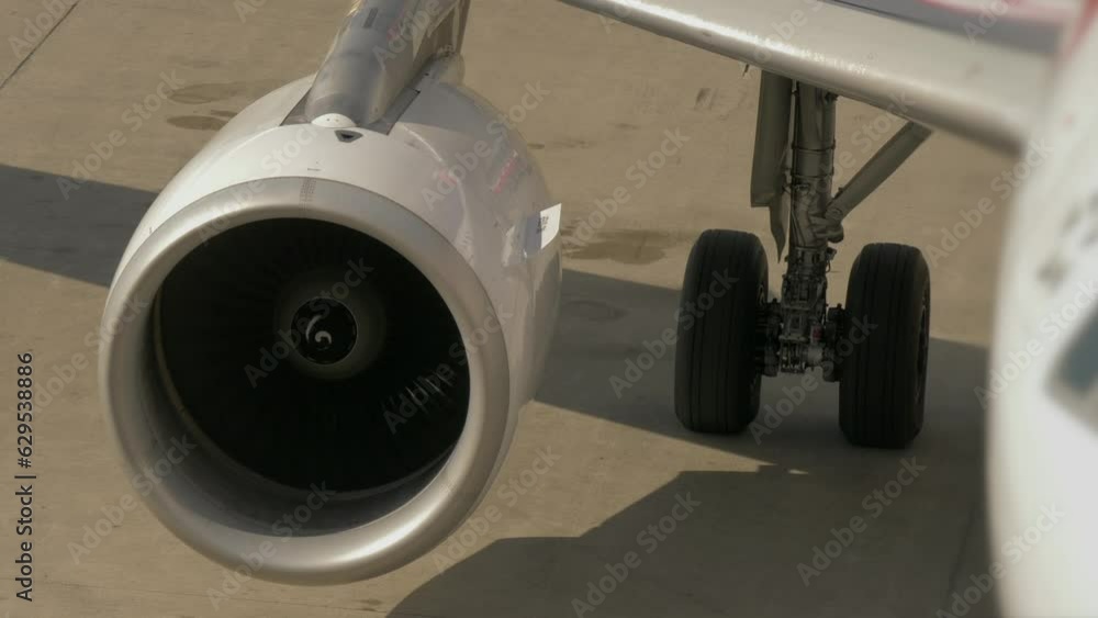 Commercial airplane landing at airport terminal runway after flight Commercial airplane landing at airport terminal runway after flight