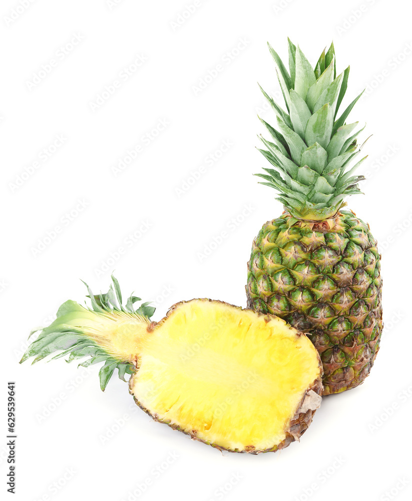 Whole and cut ripe pineapples isolated on white Whole and cut ripe pineapples isolated on white