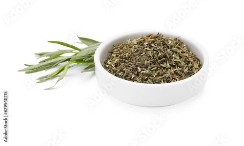 Bowl of dry tarragon and fresh leaves isolated on white
