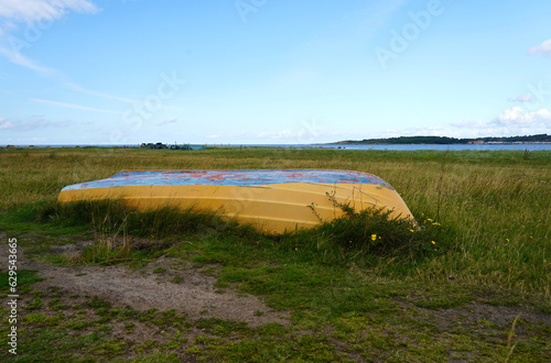 Up side down boat by the sea