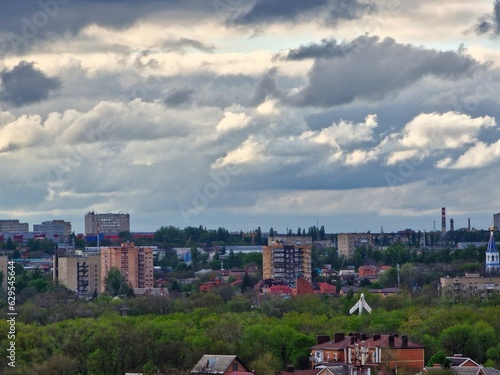 Russia, Rostov-on-Don - July, 17, 2023: panorama of a modern city in summer with brick houses against the background of gray clouds
