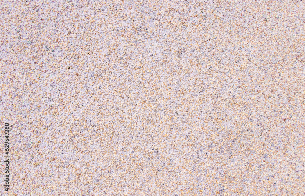 Abstract or texture background. Natural pattern used to make wallpaper website along walls of houses, building. Pebbles small or gravel color yellow, orange attached with beautiful cement concrete. Abstract or texture background. Natural pattern used to make wallpaper website along walls of houses, building. Pebbles small or gravel color yellow, orange attached with beautiful cement concrete.