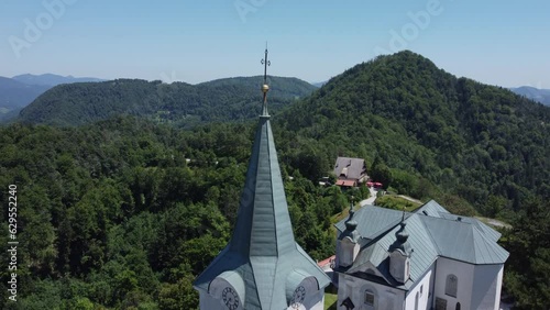 A drone view of an old church located on a hill. Camera slides up. Zasavje Holy Mountain, The Mary’s Nativity Church photo