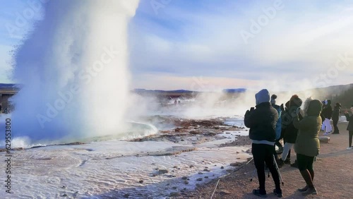 Iceland. Erupting geyser Strokkur. Strokkur is part of geothermal area. Smoke over the ground. The most beautiful places on the Earth. photo