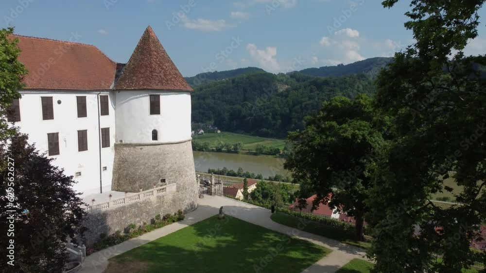 Smooth flight of the drone along the ancient castle overlooking the river. Sevnica castle in Slovenia Smooth flight of the drone along the ancient castle overlooking the river. Sevnica castle in Slovenia