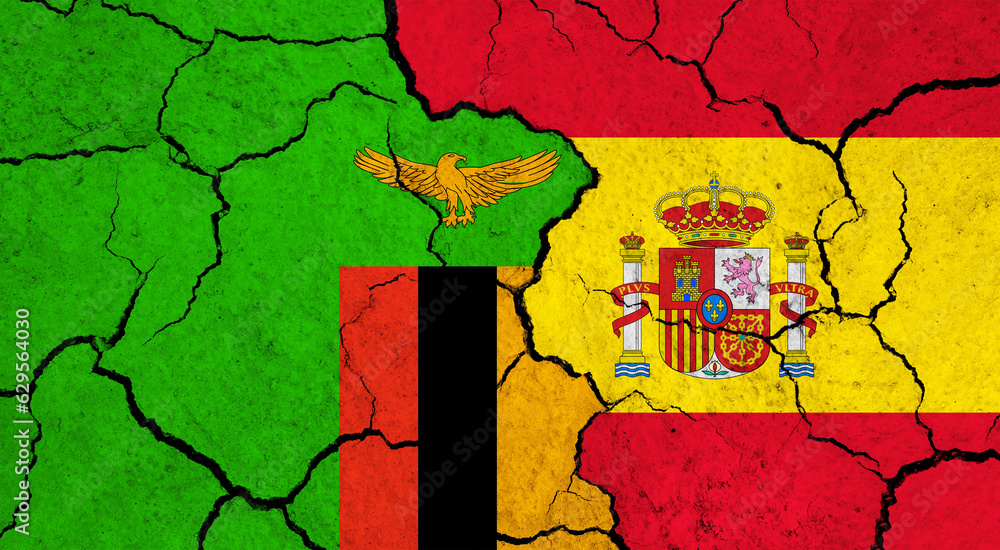 Flags of Zambia and Spain on cracked surface - politics, relationship concept