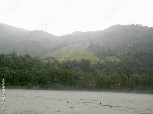 Der Sigmund Thun Klamm mit dem Klammsee und dem Fluß Kapruner Ache bei Regen und Nebel photo