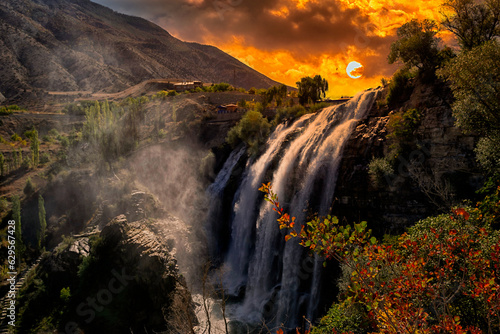 Tortum waterfall is the largest waterfall and it is one of the most remarkable natural treasures of Turkey. Beautiful waterfall view at sunset.