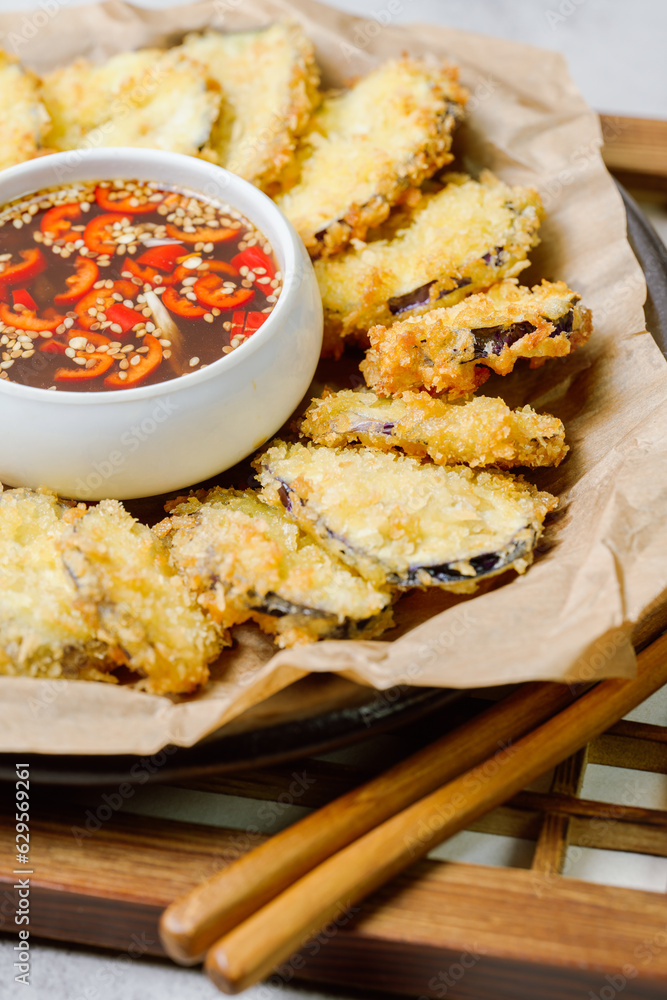 fried eggplant, Flatten the eggplant and dredge in the tempura flour