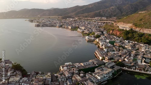 Village and lake in Shuanglang, Yunnan, China. photo