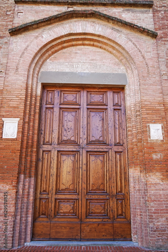 Entrance door of San Francesco church in Castelfiorentino, Tuscany, Italy