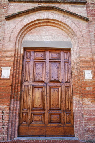 Entrance door of San Francesco church in Castelfiorentino, Tuscany, Italy © sansa55