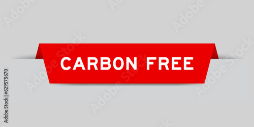 Red color inserted label with word carbon free on gray background