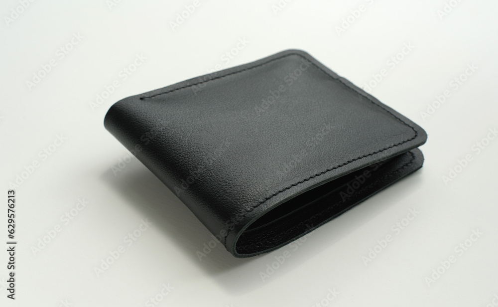 leather black men's wallet handmade from different sides on a white background leather black men's wallet handmade from different sides on a white background