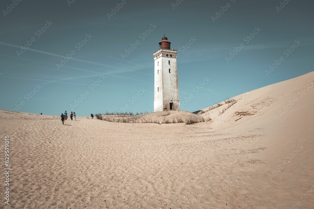 Picturesque lighthouse located in the sand dunes of Northern Denmark
