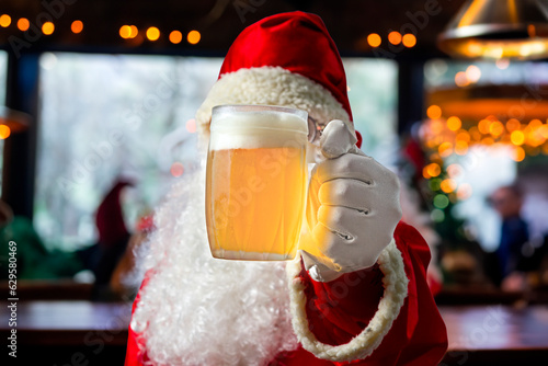 Santa Claus drinking beer in the bar