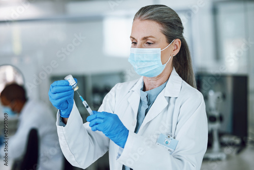 Woman doctor, scientist with mask, needle and vaccine bottle at hospital laboratory for covid research. Healthcare, medicine and medical professional with sample syringe for corona vaccination in lab
