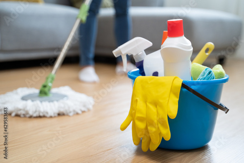 Εκτύπωση καμβά happy Female housekeeper service worker mopping living room floor by mop and cleaner product to clean dust