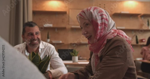 Business people talking and smiling in the cafe bar photo