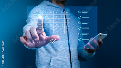 Concept of work scheduling and corporate project management, virtual calendar display, and task and milestone updating planning in process to enhance time management schedule appointments photo