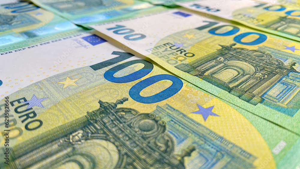 View of 100 euro banknotes. Cash banknotes. Financial business background concept. Background of cash euro bills. Money background. Single currency of the European Union. View of 100 euro banknotes. Cash banknotes. Financial business background concept. Background of cash euro bills. Money background. Single currency of the European Union.