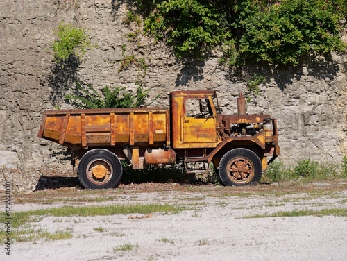 Old dump truck in the rural countryside photo