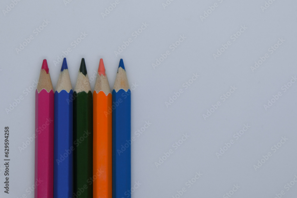 5 Coloring Pencils on Plain Background. School Education. Minimal Creative Art Artistic Materials Back to School Equipment 5 Coloring Pencils on Plain Background. School Education. Minimal Creative Art Artistic Materials Back to School Equipment