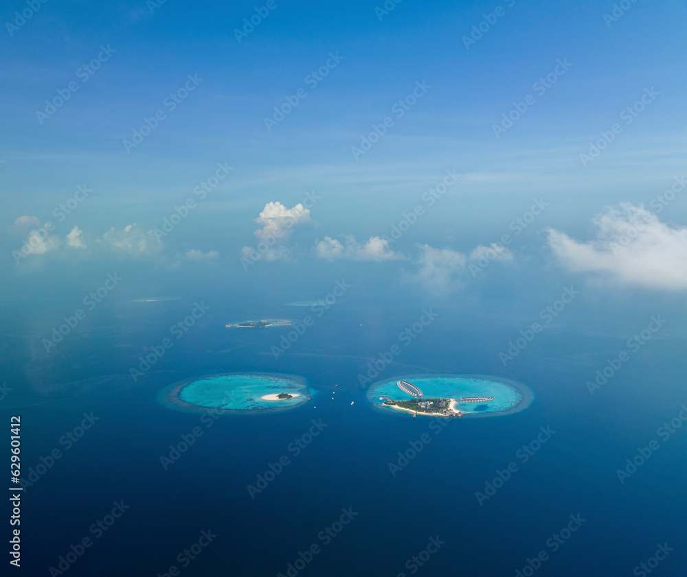 Aerial view of scattered islands on the Indian Ocean at Maldives Archipelagos. Aerial view of scattered islands on the Indian Ocean at Maldives Archipelagos.