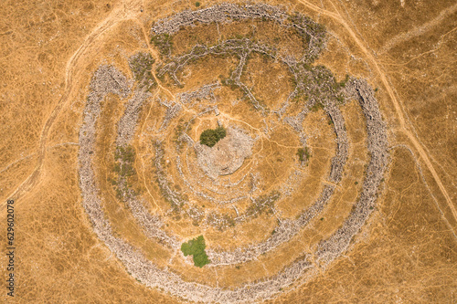 Aerial view of ancient megalithic monument site in the shape of 3 concentric stone circles, Rujum Al-Hiri, Golan Heights, Israel. photo