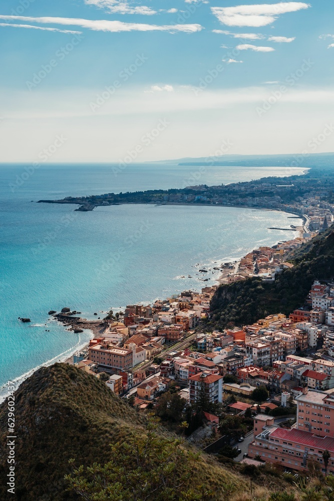 Aerial view of a picturesque Italian coastal town, with colorful buildings