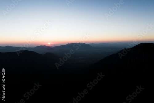 Wallpaper Mural Aerial view of the sun setting down across the valley in Serino along the Mount Terminio with National park, Campania, Avellino, Italy. Torontodigital.ca