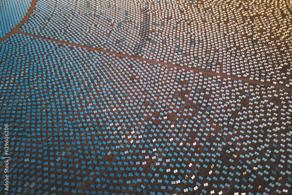 Aerial view of a concentrated solar thermal plant at sunrise, Mojave Desert, California, near Las Vegas, United States. Aerial view of a concentrated solar thermal plant at sunrise, Mojave Desert, California, near Las Vegas, United States.
