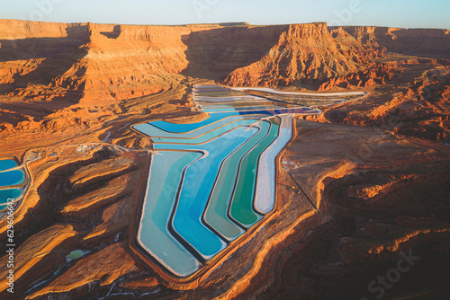 Aerial view of colorful Potash Ponds at sunrise, near Moab, Utah, United States.