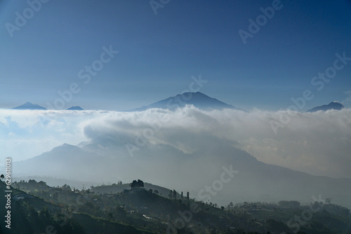 Mountainside view with sea of clouds and mountain ranges