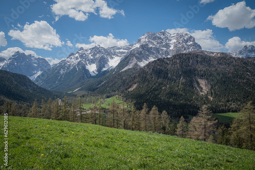 landscape of beautiful mountains in the alps cloudy day with blue sky