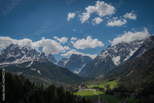 landscape of beautiful mountains in the alps cloudy day with blue sky © Jan