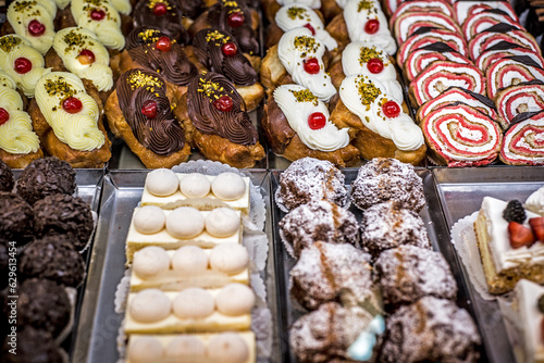 Production of delicious desserts with cream and cream in a confectionery factory in Sicily, Italy.