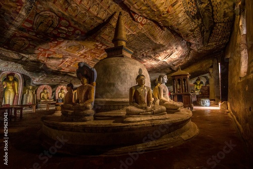 Fototapeta Interior view of the Dambulla Cave Temple in Sri Lanka, featuring statues of the