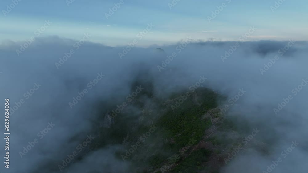 Drone view of a building with a round dome in rough sightseeing mountain landscapes Drone view of a building with a round dome in rough sightseeing mountain landscapes