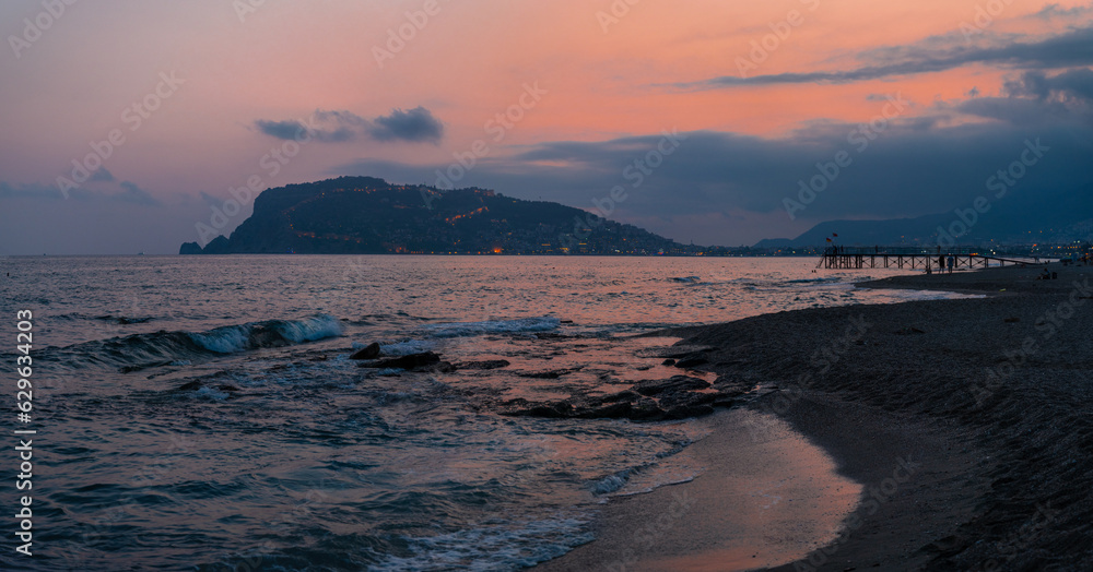 Beautiful evening scene on Alanya beach in Turkey