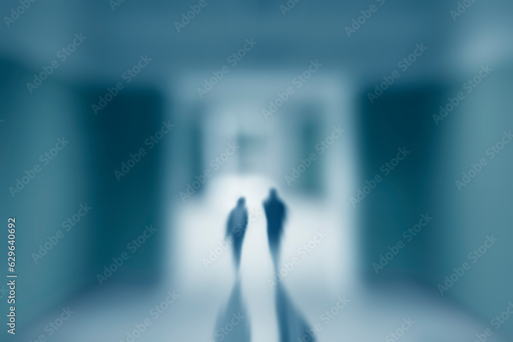 Silhouettes of people walking in a corridor. Light at the end of the tunnel, healing concept. People walking into the unknown