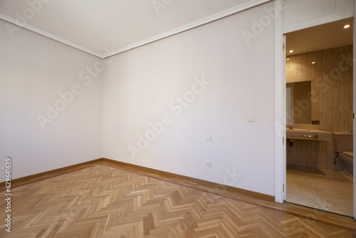 Empty room with an en-suite bathroom, beautiful oak parquet floors