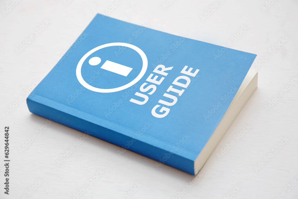 User guide book, Blue cover book on white background, instruction manual for user training  - obrazy, fototapety, plakaty 