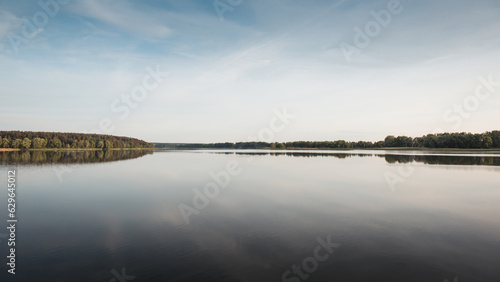 Canvas-taulu Summer scene on lake: refection of forest trees in the water of pond