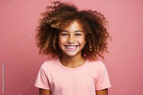 laughing girl on a pink background portrait © stasknop