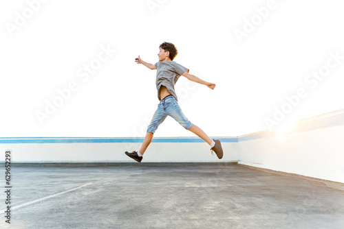 Caucasian teenage boy jumping outdoors