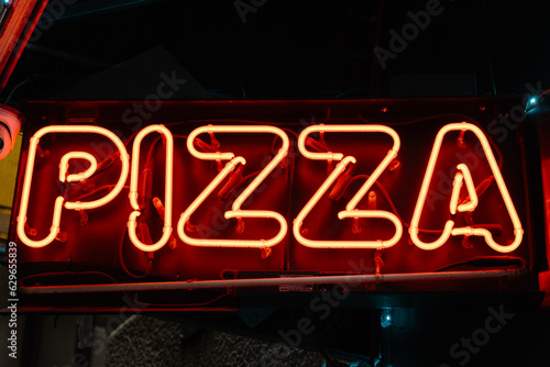 neon sign with pizza word