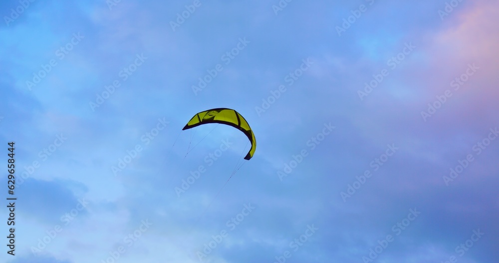 Boarding kite soars in air high in sky. Millennial outdoor lifestyle is boarding on waves with kite in wild nature. Cinematic video of Millennial kiteboarding outdoor lifestyle to feel freedom. Boarding kite soars in air high in sky. Millennial outdoor lifestyle is boarding on waves with kite in wild nature. Cinematic video of Millennial kiteboarding outdoor lifestyle to feel freedom.