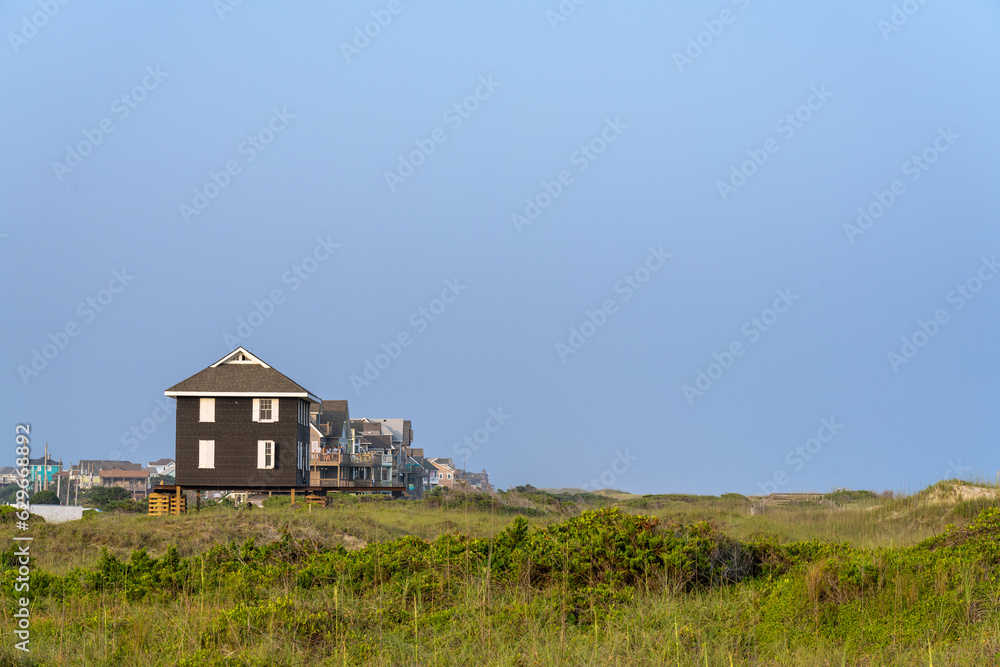 Beach Homes on Hatteras Island in Between a Wide Expanse of Tidal Dunes in North Carolina Beach Homes on Hatteras Island in Between a Wide Expanse of Tidal Dunes in North Carolina